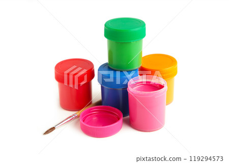 Multicolored jars of gouache and a brush isolated on white background. Creative kit. 119294573
