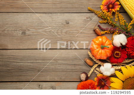 Autumn composition. Frame made of fresh flowers on grey wooden background. Flat lay, top view, copy space. Thanksgiving day Autumn composition. Frame made of fresh flowers on grey wooden background. Flat lay, top view, copy space. Thanksgiving day 119294595