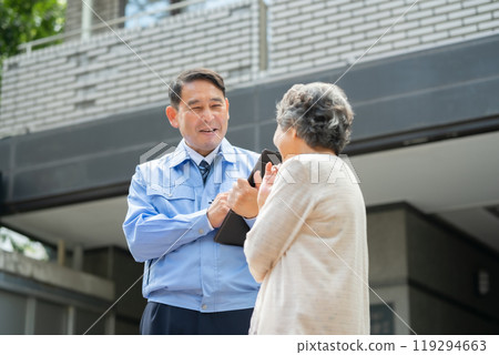 Man in work clothes and senior woman inspecting Man in work clothes and senior woman inspecting 119294663