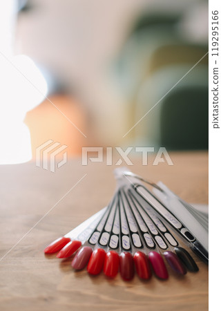 Nail polish samples in different bright colors. Colorful nail lacquer manicure swatches. Top view of nail art wheel palette 119295166