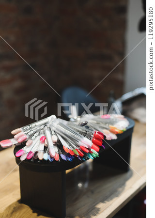 Nail polish samples in different bright colors. Colorful nail lacquer manicure swatches. Top view of nail art wheel palette 119295180