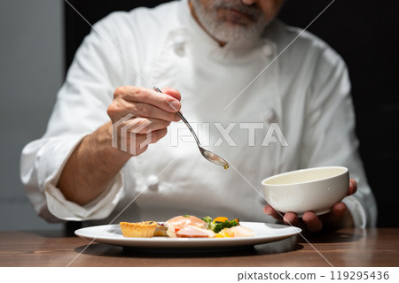 Chef plating appetizers 119295436