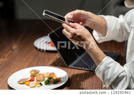Chef taking a photo of the food 119295461