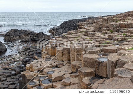 Basalt columns of Giant Causeway lead to the Atlantic Ocean along the rugged Northern Irish coast Basalt columns of Giant Causeway lead to the Atlantic Ocean along the rugged Northern Irish coast 119296080