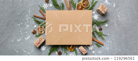 Flat lay Christmas composition. square Paper blank, pine tree branches, christmas decorations on Colored background. Top view, copy space for text Flat lay Christmas composition. square Paper blank, pine tree branches, christmas decorations on Colored background. Top view, copy space for text 119296561