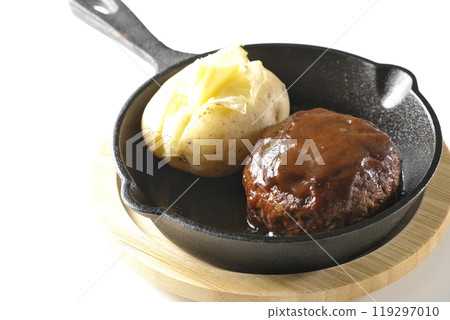 Hamburg steak and buttered potatoes photographed on a white background Hamburg steak and buttered potatoes photographed on a white background 119297010
