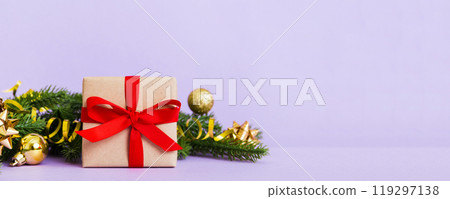 New Year Christmas mood, gift box, branches of a christmas tree, New Year decorations on a colored background 119297138