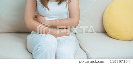 woman having abdomen ache due to Stomach pain, digestion with constipation or Diarrhea from food poisoning, female problem and Endometriosis, Hysterectomy, Stomachache and Menstrual on sofa at home woman having abdomen ache due to Stomach pain, digestion with constipation or Diarrhea from food poisoning, female problem and Endometriosis, Hysterectomy, Stomachache and Menstrual on sofa at home 119297304