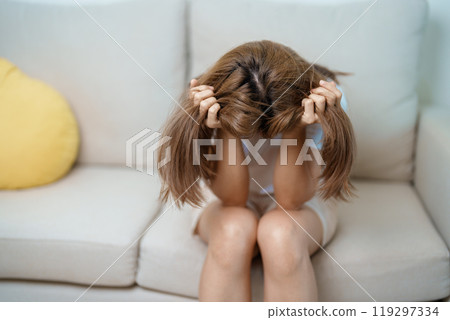 Stress, Sad and unhappy concepts. Alone asian Woman having headache, Young female feeling frustrated, exhausted and suffering 119297334