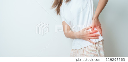 woman having back body ache during at home. adult female with muscle pain due to Piriformis Syndrome, Low Back Pain and Spinal Compression. Office syndrome and medical concept 119297363