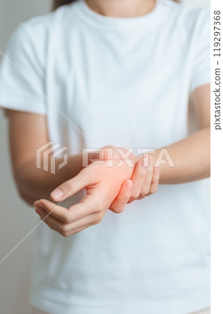 Woman having wrist pain at home, muscle ache due to De Quervain s tenosynovitis, ergonomic, Carpal Tunnel Syndrome or Office syndrome and Parkinson disease concept 119297368