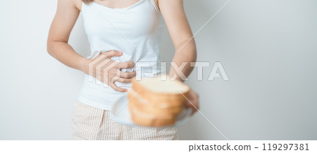 Gluten intolerance, Gluten free and celiac disease or wheat allergy concept. woman hold Bread and having abdominal pain after eat gluten. stomach ache, Nausea, Bloating, Gas, Diarrhea and Skin rash 119297381