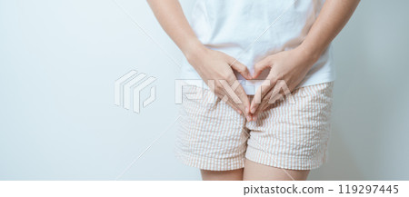 Woman hand heart shape over abdomen. Ovarian and Cervical cancer, Endometriosis, Hysterectomy, Uterine fibroids, Reproductive, menstruation, Stomach, Pregnancy and Sexual Transmitted disease concept Woman hand heart shape over abdomen. Ovarian and Cervical cancer, Endometriosis, Hysterectomy, Uterine fibroids, Reproductive, menstruation, Stomach, Pregnancy and Sexual Transmitted disease concept 119297445