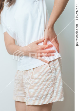 woman having back body ache during at home. adult female with muscle pain due to Piriformis Syndrome, Low Back Pain and Spinal Compression. Office syndrome and medical concept woman having back body ache during at home. adult female with muscle pain due to Piriformis Syndrome, Low Back Pain and Spinal Compression. Office syndrome and medical concept 119297448