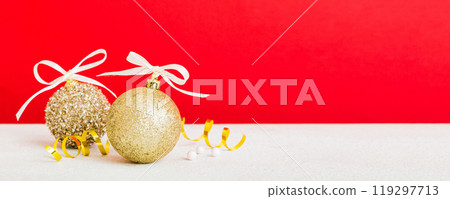 Christmas ball on colored background. decoration bauble with ribbon bow with copy space 119297713