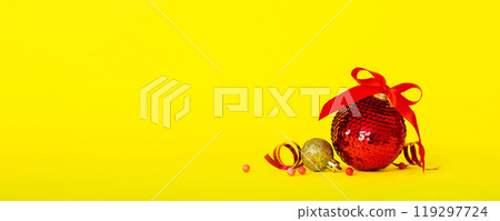 Christmas ball on colored background. decoration bauble with ribbon bow with copy space 119297724