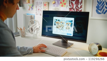 Young man enters prompt in AI image generator on PC 119298266