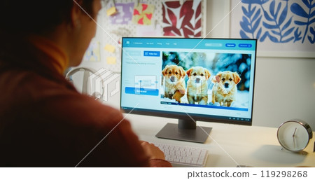 Close up of man typing text prompt in AI video generator on computer Close up of man typing text prompt in AI video generator on computer 119298268