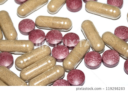 Vitamin Capsules and Pills on a White Background For Medication round and long shaped 119298283