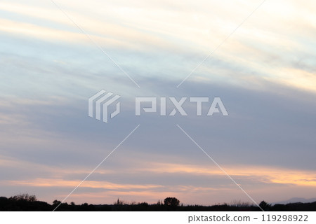 Autumn sky, sunset, clouds, silhouette of trees and mountains 119298922