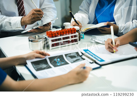 Doctors working together on digital tablet healthcare doctor technology tablet information about drug using computer in a modern office. Doctors working together on digital tablet healthcare doctor technology tablet information about drug using computer in a modern office. 119299230