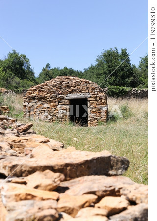 Old and typical stone hut called caborne in French language in Saint Cyr au Mont d'or, France 119299310