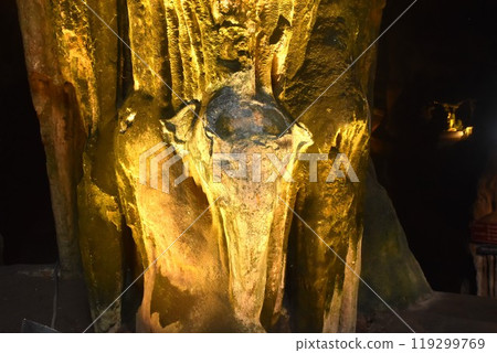 elephant statue rock in cave hole of Khao Luang cave travel location on Thailand 119299769