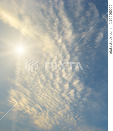 Blue sky with white clouds and bright sun. 119300003