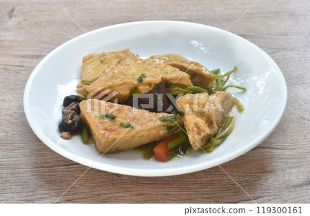 fried tofu with mixed vegetable in sweet and sour gravy sauce vegetarian food on plate fried tofu with mixed vegetable in sweet and sour gravy sauce vegetarian food on plate 119300161