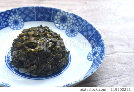 stir fried pickled mustard or Gan Lan Cai Chinese food made from cabbage and black olive in oil on plate stir fried pickled mustard or Gan Lan Cai Chinese food made from cabbage and black olive in oil on plate 119300231