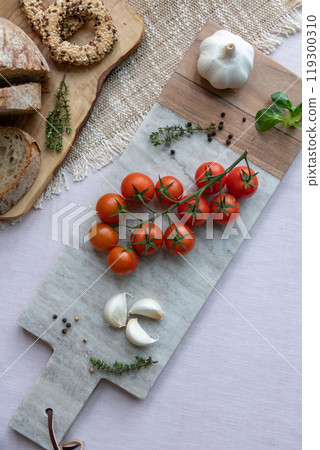 Cherry tomatoes on the marble cutting board Cherry tomatoes on the marble cutting board 119300310