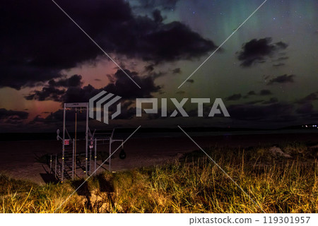 The Aurora Borealis, the northern lights, showing up in Portnoo, County Donegal, Ireland. The Aurora Borealis, the northern lights, showing up in Portnoo, County Donegal, Ireland. 119301957