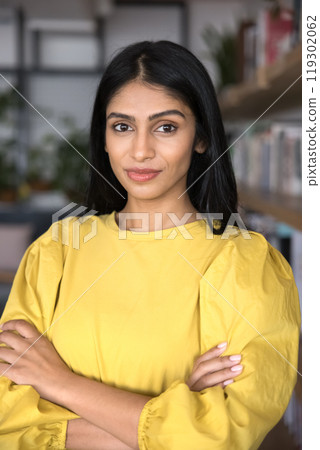 Confident Indian professional woman in casual posing for vertical portrait 119302062