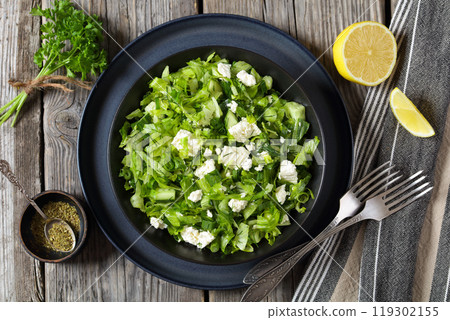 Classic Greek green lettuce salad with feta cheese Classic Greek green lettuce salad with feta cheese 119302155