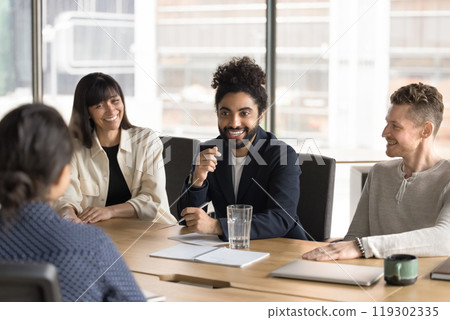 Happy cheerful Indian startup leader brainstorming on project 119302335
