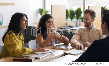 Diverse Indian and Caucasian business group having fun together Diverse Indian and Caucasian business group having fun together 119302519