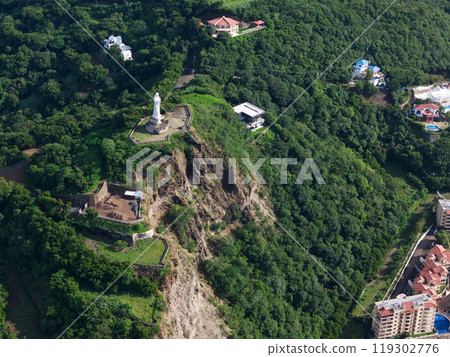 Jesus christ statue on rock 119302776
