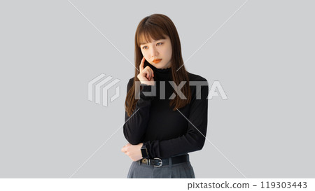 A young woman/businesswoman thinking 119303443
