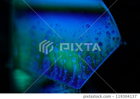 Bright reflection of liquid in macro, blue and silver colors, rainbow background, Blue bubbles in macro, connection of bubbles in macro, cell from liquid, molecules connection, ultra macro 119304137