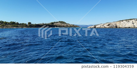 Azure Aegean sea view. Vourvourou village, Diaporos island. North Greece 119304359