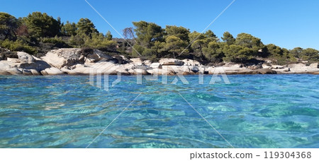 Azure Aegean sea view. Vourvourou village, Diaporos island. North Greece 119304368