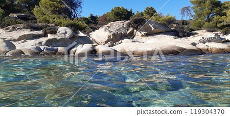 Azure Aegean sea view. Vourvourou village, Diaporos island. North Greece 119304370