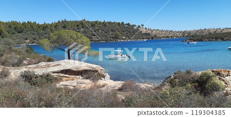 Azure Aegean sea view. Vourvourou village, Diaporos island. North Greece 119304385