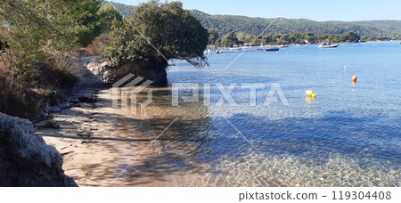 Azure Aegean sea view. Vourvourou village, Diaporos island. North Greece Azure Aegean sea view. Vourvourou village, Diaporos island. North Greece 119304408