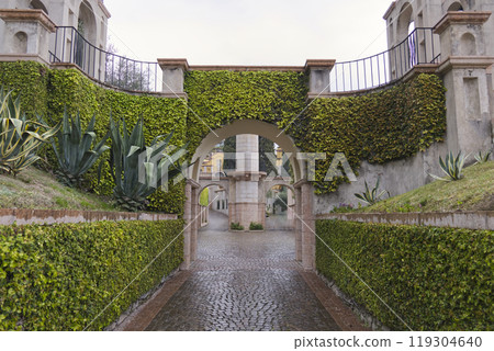Opened gated entrance to a stately home garden. Opened gated entrance to a stately home garden. 119304640