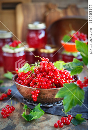 Fresh ripe Red currant or Red Ribes (Ribes rubrum) on wooden rustic background Fresh ripe Red currant or Red Ribes (Ribes rubrum) on wooden rustic background 119305165