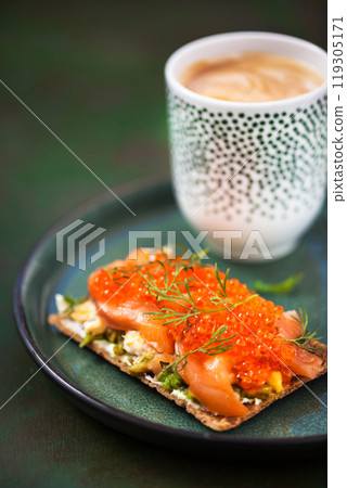 Avocado, salted salmon, egg and red caviar rye crisp toast Avocado, salted salmon, egg and red caviar rye crisp toast 119305171