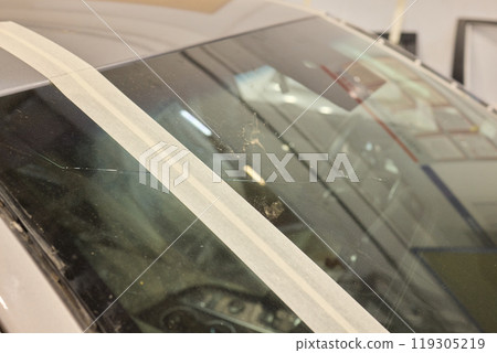 In an emergency, cover broken car window with duct tape for a quick roadside fix 119305219