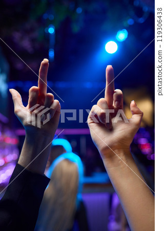 Hands Forming a Heart Shape in the Midst of a Vibrant and Joyful Celebration Event 119306438