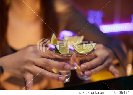 Enjoying a Refreshing Beer with a Lime Slice Placed on Top for Extra Flavor and Zest 119306455